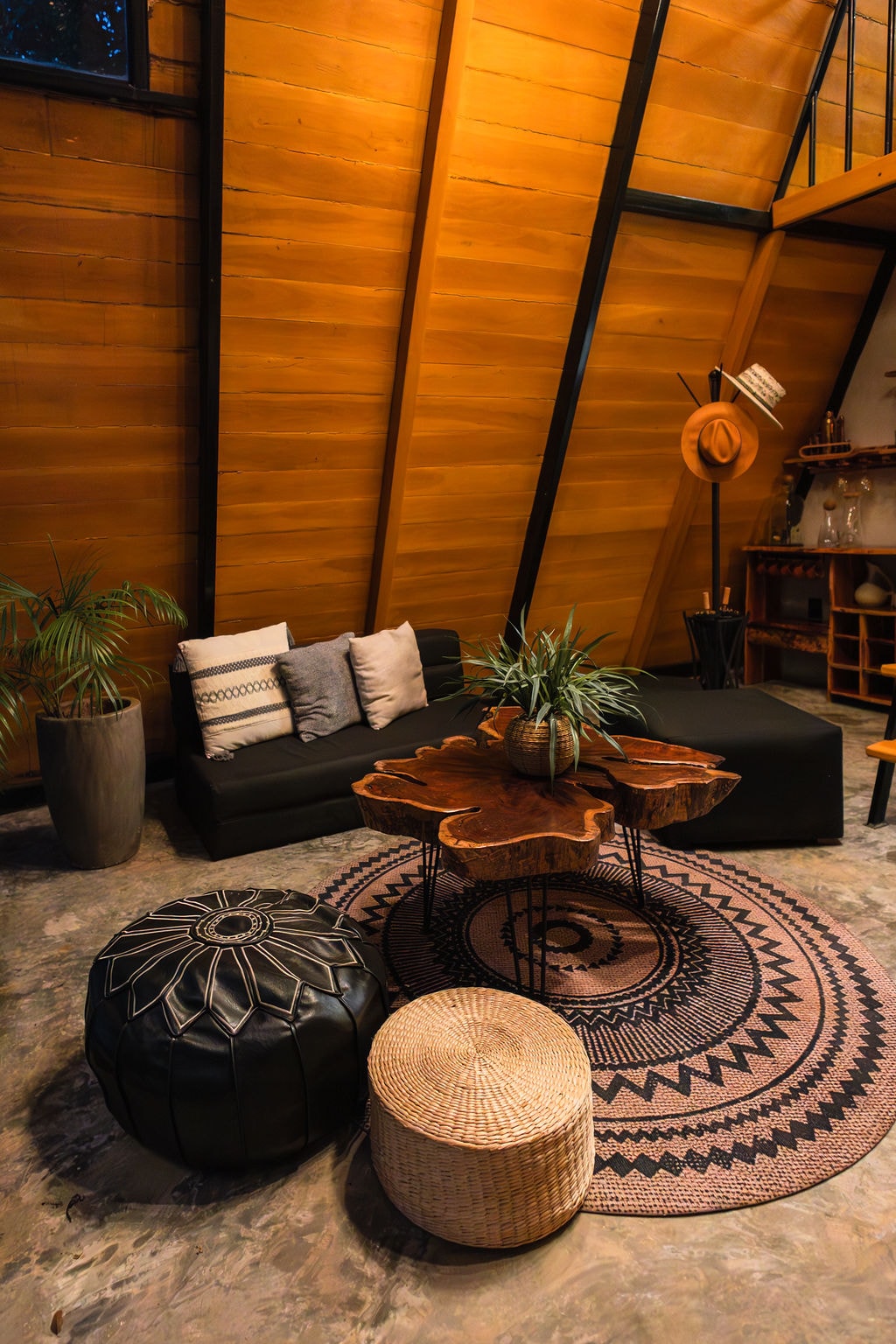Bohemian lounge with live-edge coffee table inside the A-frame at Casa Tattva
